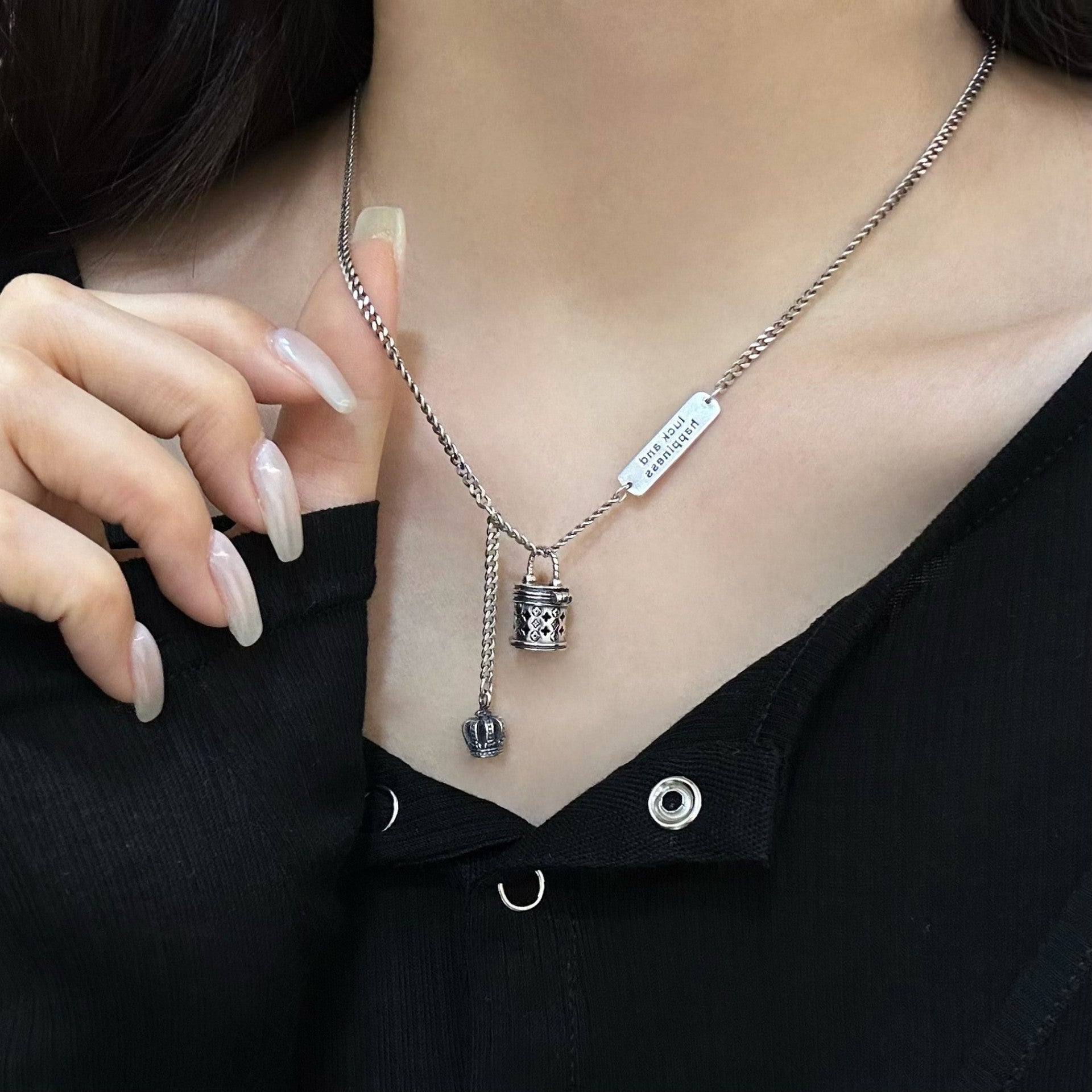 The S925 sterling silver monogram bucket bag necklace can be unlocked, with a pendant, hollow crown, niche design, and a light luxury and high-end necklace