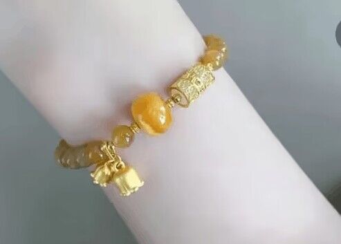 Xiaohongshu bestseller: Caramel-colored beeswax bracelet, stone music pendant, Chinese style, elegant niche design